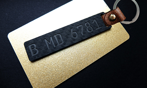 carbon license plate keychain engraved with leather posture