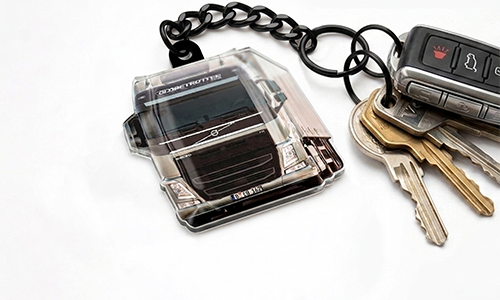 Truck-shaped keychain attached to a set of keys, showing a detailed front view of the vehicle
